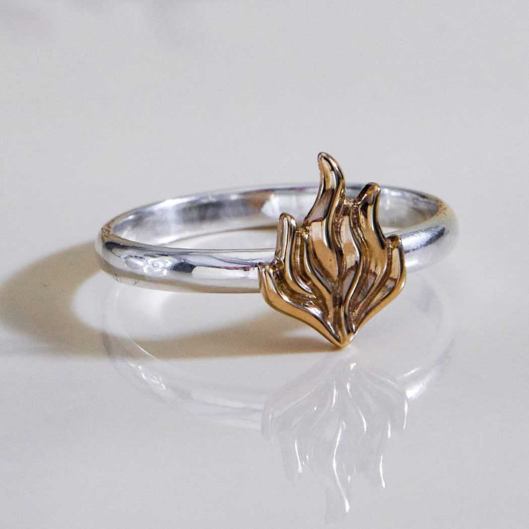 Silver ring with bronze flame