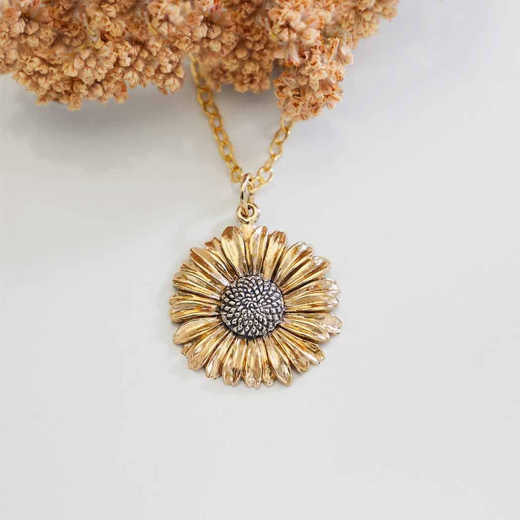 Gold filled halsketting met bronzen/zilveren madeliefje