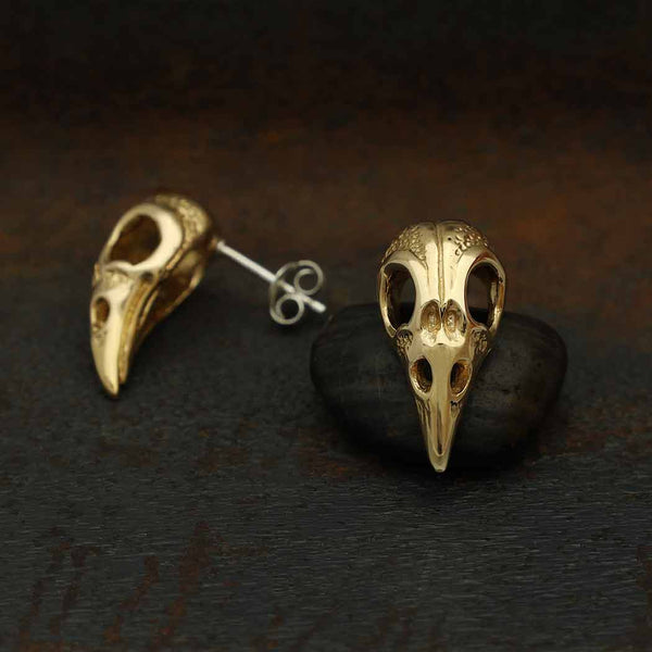 Zilveren oorbellen met bronzen ravenschedel
